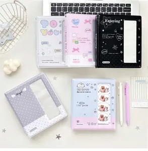 Detailed top view of assorted mini photo albums with cute polka dot and cat themed covers