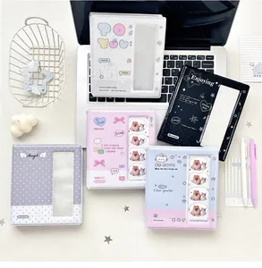 Detailed view of polka dot mini photo albums with transparent cover slots for kpop cards
