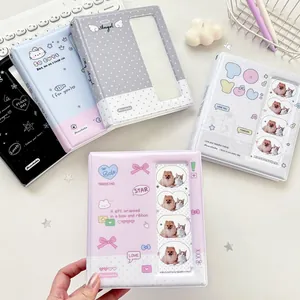 Cute polka dot cartoon photo albums and card holders displayed on a minimalist desk