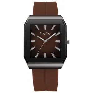 Detail of square quartz watch with brown gradient dial and flexible silicone strap