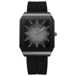 Detail of square gunmetal watch case with black silicone strap and gradient dial