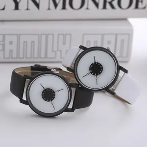 Detail view of minimalist black and white quartz watches with unique counter-clockwise dial