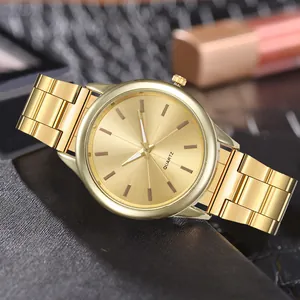Detailed close-up of a gold business quartz watch with a classic sunburst dial design