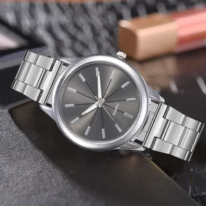 Detail of minimalist stainless steel quartz watch with silver strap and sunray gray dial