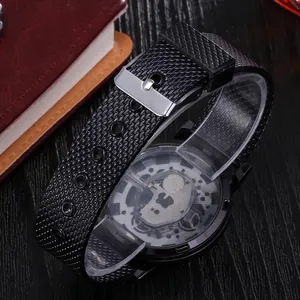 Close-up of black textured watch strap and skeleton back with silver buckle detailing