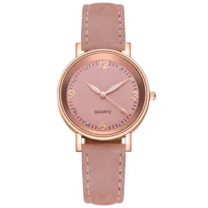 Close-up of pink quartz watch face with rose gold case and rhinestone hour markers