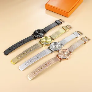 Four women's mesh band watches in gold, silver, black, and rose gold with heart dial details