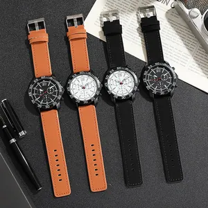 Close-up of men's quartz sports watches with leather straps on a vintage background