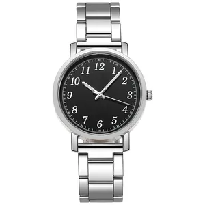 Detailed view of silver quartz watch with black dial and white numeric markings