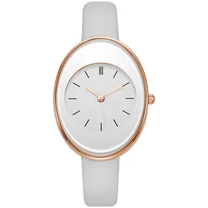 Detail of rose gold oval quartz watch with white dial and grey slim leather strap
