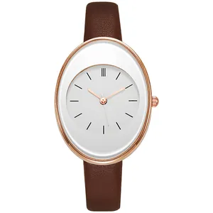 Detail of rose gold oval quartz watch with white dial and brown leather strap