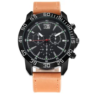 Detail of sports quartz watch with black dial, luminous hands and brown leather strap