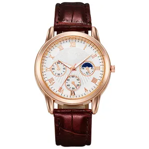 Macro view of men's business watch with rose gold case and brown leather strap