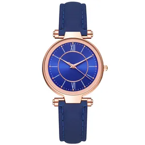 Montre élégante pour femme avec boîtier or rose, cadran bleu et bracelet en cuir assorti