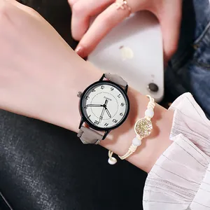 Orologio al quarzo luminoso con cinturino in pelle e bracciale intrecciato al polso