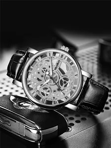 Macro shot of skeleton mechanical watch dial with Roman numerals and silver case