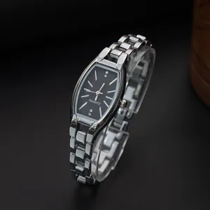 Elegant vintage silver tonneau quartz watch with black dial and crystal hour markers