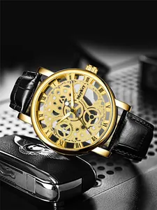 Close-up of skeleton watch with golden mechanical gears and black leather strap