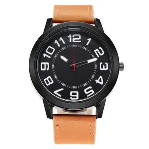 Detail of a brown leather strap and black metal case with white Arabic numerals on the watch