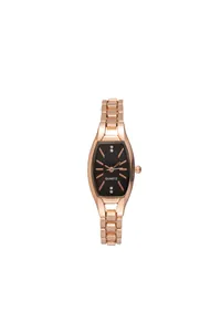 Detail of rose gold tonneau watch face with black dial and crystal markers