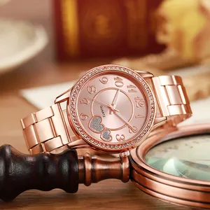 Elegant rose gold women's quartz watch with rhinestone bezel and heart dial pattern