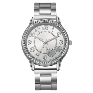 Close-up of women's silver quartz watch featuring rhinestone bezel and heart-shaped dial