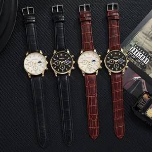 Flat lay of Geneva men's quartz watches with leather straps and gold cases in macro detail