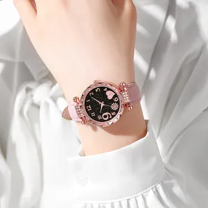 Orologio da donna in oro rosa con quadrante nero stellato, cuori rosa e motivi floreali