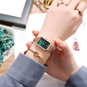 Detail of square green watch dial with rose gold mesh band and star bracelet set