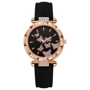 Detailed macro view of rose gold watch case with crystal bezel and butterfly dial