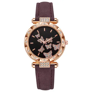 Macro view of rose gold floral bezel with rhinestones and purple strap detail