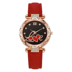 Montre quartz femme avec bracelet en daim rouge, boîtier or rose strass et cadran étoilé