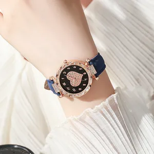 Orologio elegante oro rosa con quadrante cuore di strass e cinturino in pelle blu