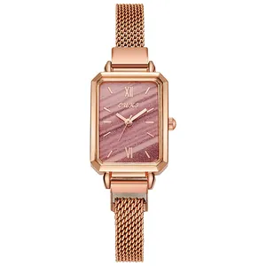 Detail view of rectangular rose gold watch with purple marble dial and Milanese mesh band