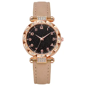 Orologio al quarzo da donna con quadrante nero stellato e cinturino in pelle beige