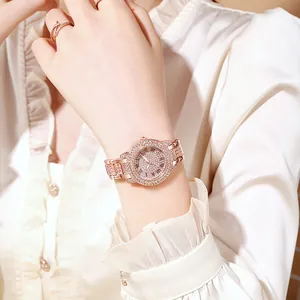 Detail of rose gold women's watch with full crystal inlay and Roman numeral dial