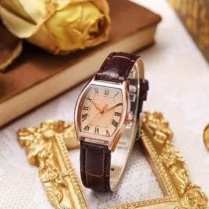 Vintage tonneau quartz watch with leather strap and roman numerals on gold frame