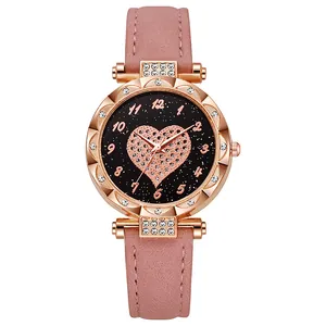 Pink faux leather strap quartz watch with rose gold heart dial and rhinestone bezel
