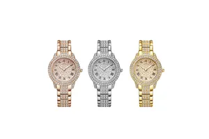 Close-up of three sparkling rhinestone watches in rose gold, silver, and gold with Roman numerals