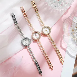 Elegant quartz women watch with pearl chain strap and sparkling rhinestone bezel
