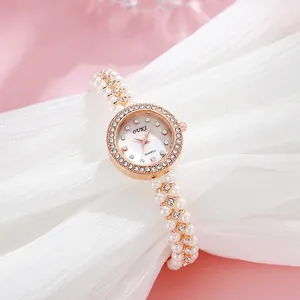 Elegant women's quartz watch featuring a pearl chain strap and rhinestone bezel