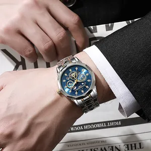 Detail of blue dial quartz watch with hollow design and silver-gold steel bracelet