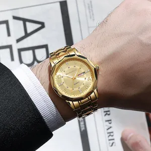 Close-up of men's gold quartz watch with rhinestone markers and day-date display window