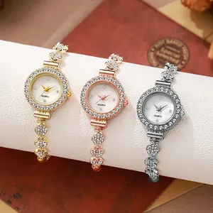 Close-up of three sparkling rhinestone-set quartz watches in gold, rose gold and silver