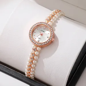 Elegant rose gold quartz watch with pearl bead bracelet and crystal bezel in a gift box