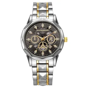 Macro shot of silver and gold stainless steel band with detailed skeleton watch dial