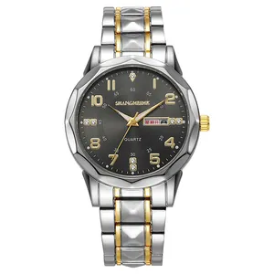 Detail of quartz watch with two-tone steel band and grey dial featuring day-date display
