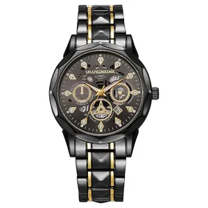 Detail of multi-function men's watch with hollow dial and gold-tone steel bracelet