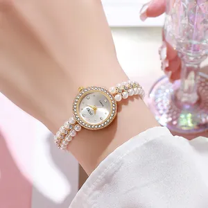 Elegant gold round watch for women with sparkling rhinestones and pearl bead bracelet strap