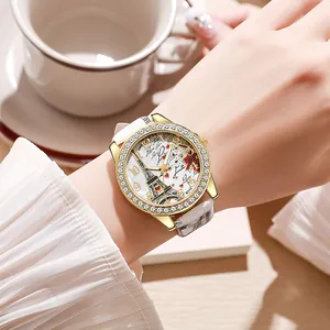 Montre quartz dorée pour femme avec cadran Tour Eiffel et bracelet cuir blanc motif serpent